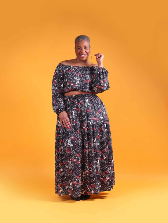 Two piece crop top skirt set with pockets and newspaper writing. 